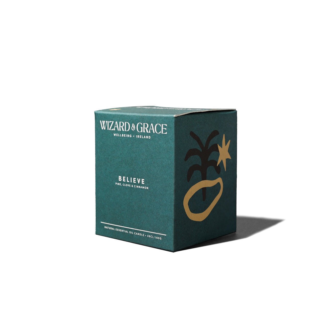 Wizard & Grace "Believe" Essential Oil Candle with a pine, clove, and cinnamon scent.