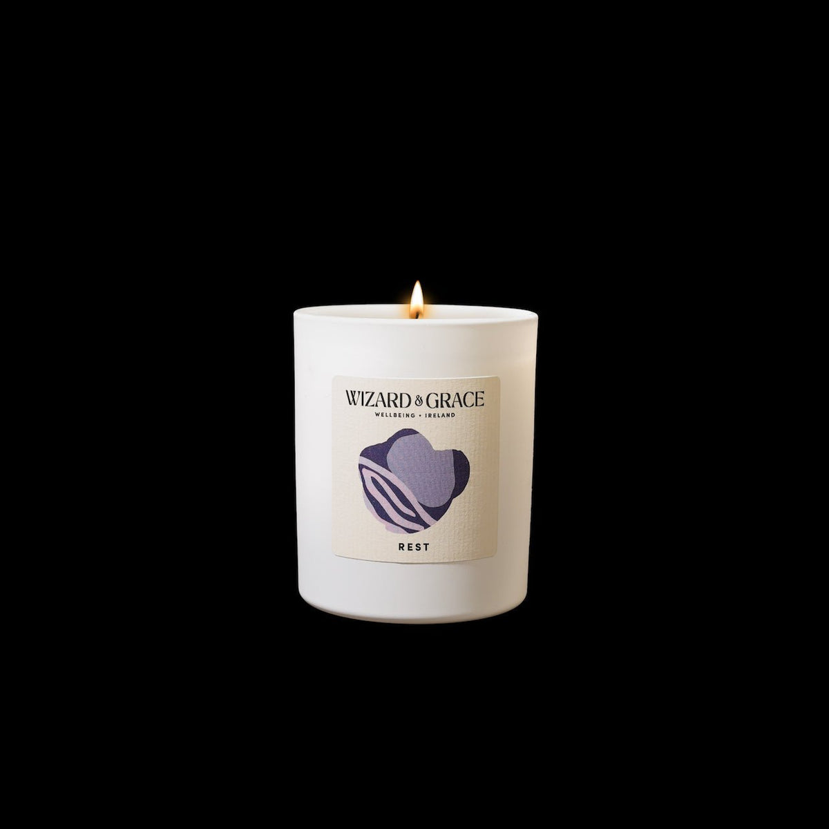 Rest Oiche (Night) Essential Oil Candle by Wizard &amp; Grace, featuring an aromatic floral scent with Lavender, Chamomile, and Clary Sage.
